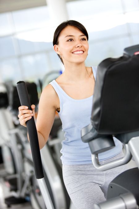 beautiful woman at the gym doing cardio exercise