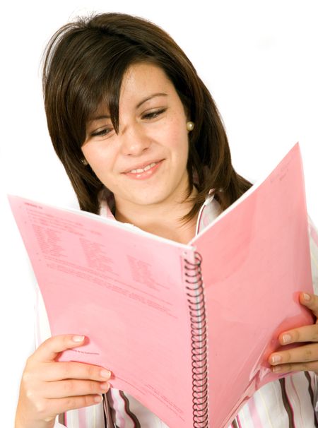 beautiful student reading a pink notebook over white background