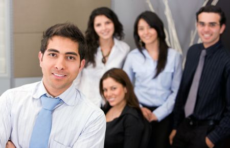 businessman leading a business team in an office