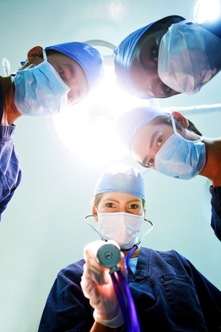 group of doctors in a hospital during surgery
