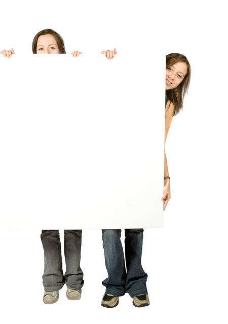 twin sisters holding a white banner over a white background