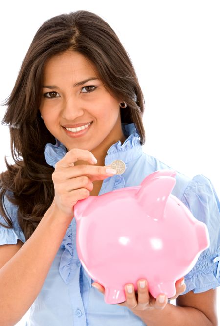 casual woman saving money in a piggy bank isolated on white