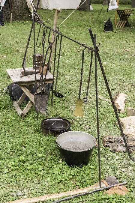 Antique cookware in military camp at a reenactment of the American Revolutionary War (1775-1783)
