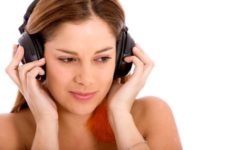Woman listening to music isolated over a white background