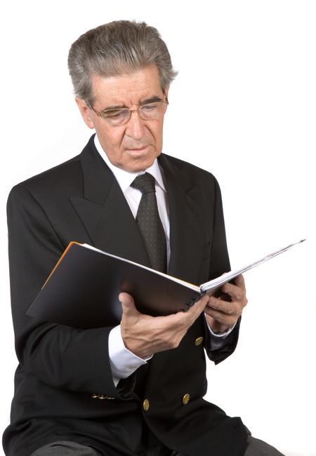business man reading a book over a white background