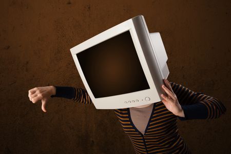 Girl with a computer monitor on her head and empty brown copyspace