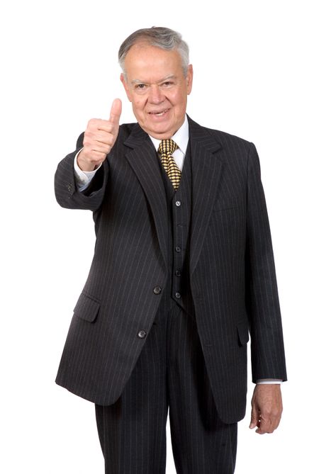 business senior smiling with thumbs up - focus is on face