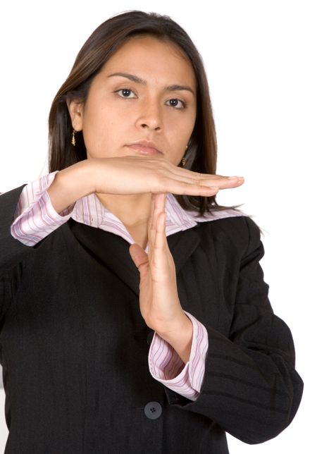 business woman signaling time out with her hands on a white background