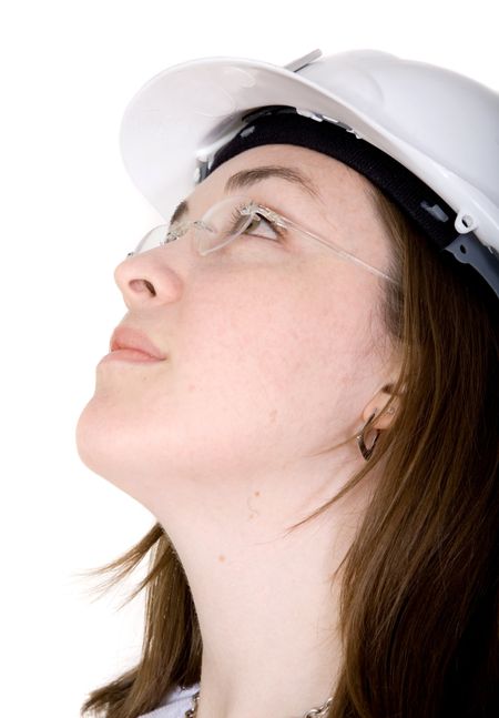 architect girl wearing a safety helmet over a white background with a pensive face