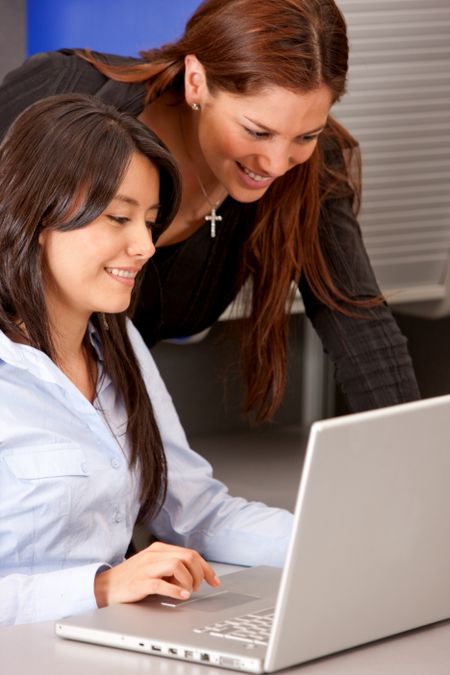 business women working on a laptop computer isolated over a white background