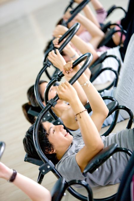 Image of a group working out on an abs machine