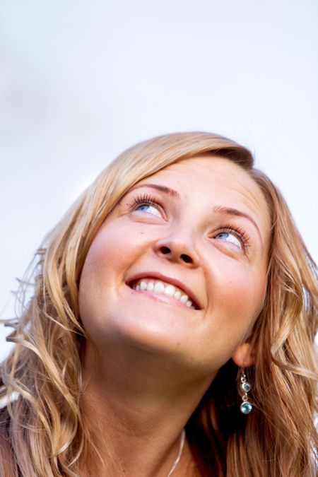 beautiful woman portrait smiling and looking up