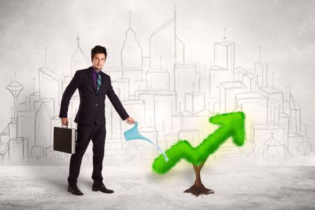 Business man watering green plant arrow concept on background
