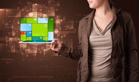 Young lady holding tablet with modern software operational system
