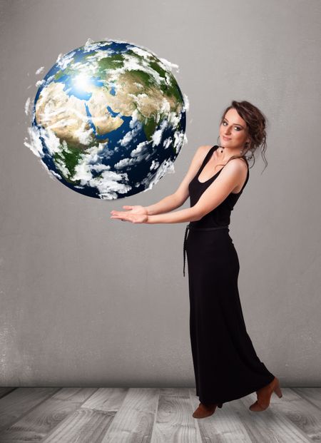 Pretty young girl holding 3d planet earth