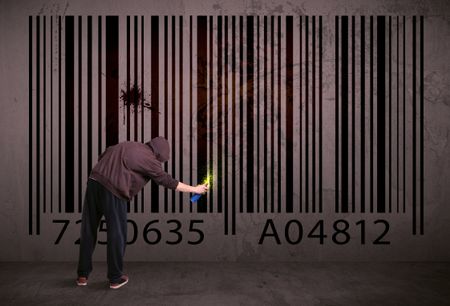 Young urban painter drawing a barcode on the wall 