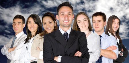 confident business man and his business team - group formed of people from all over the world over a sky
