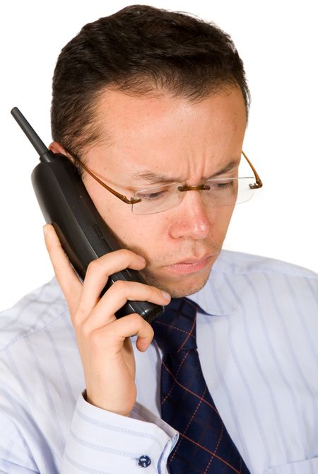 business man - bad news on the phone over a white background