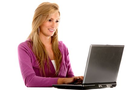 Casual woman using a laptop isolated on white