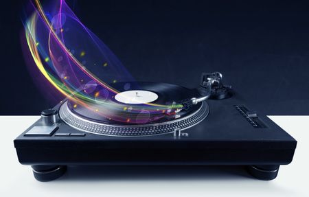 Turntable playing vinyl with glowing abstract lines concept on background