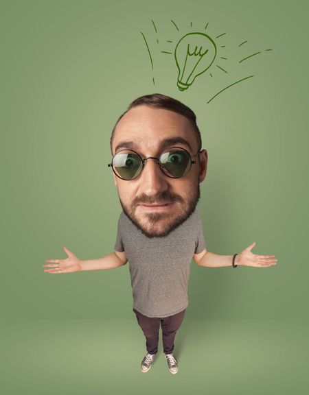 Funny person with big head and drawn idea bulb over it
