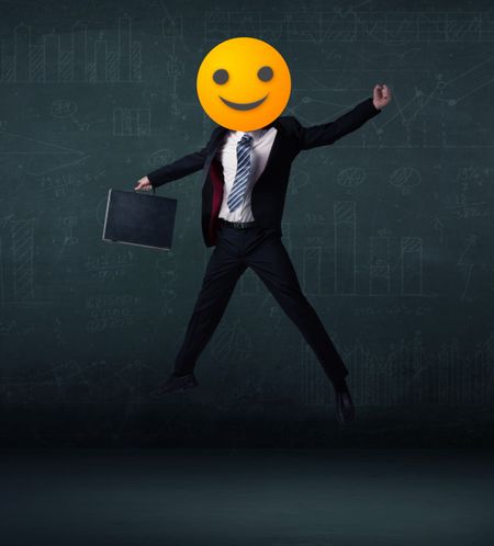 Funny businessman wears yellow smiley face