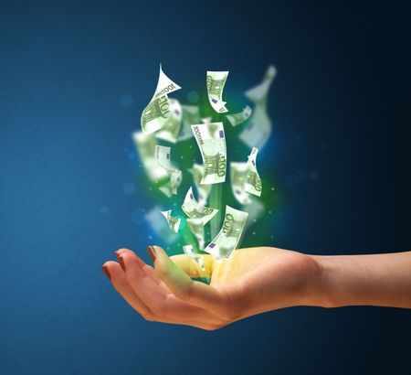Woman holding glowing paper moneys in her hand
