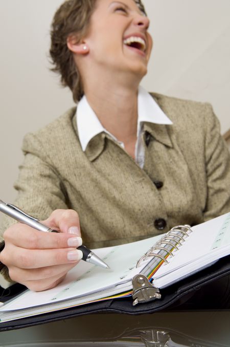 Close up of  businesswoman writing in planner