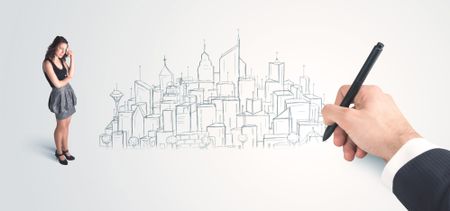 Businesswoman looking at hand drawn city on wall concept on background
