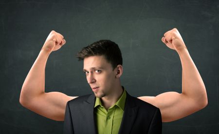 Young businessman wondering with strong and muscled arms concept