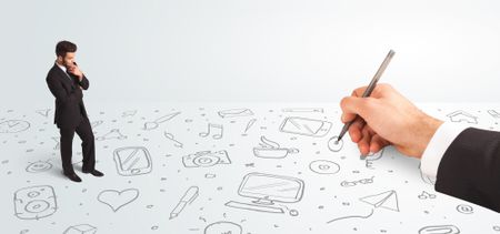 Little businessman looking at hand drawn icons and symbols concept on background