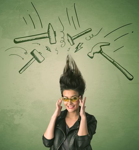 Tired woman with hair style and headache hammer symbols concept on background