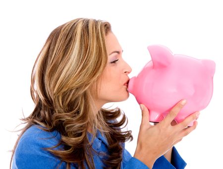 Business woman kissing a piggy bank isolated