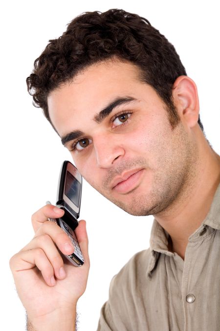 Business man on a cellphone - looking at the camera over a white background