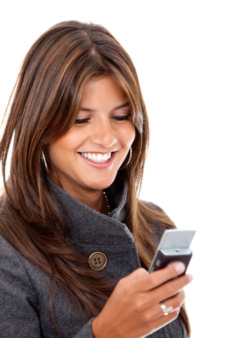 business woman sending a text message on her mobile phone - isolated