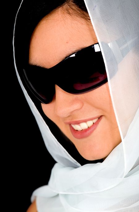 fashion woman wearing sunglasses wearing a veil over a black background