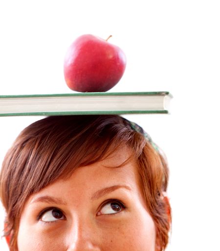 Woman's face with a book and an apple isolated