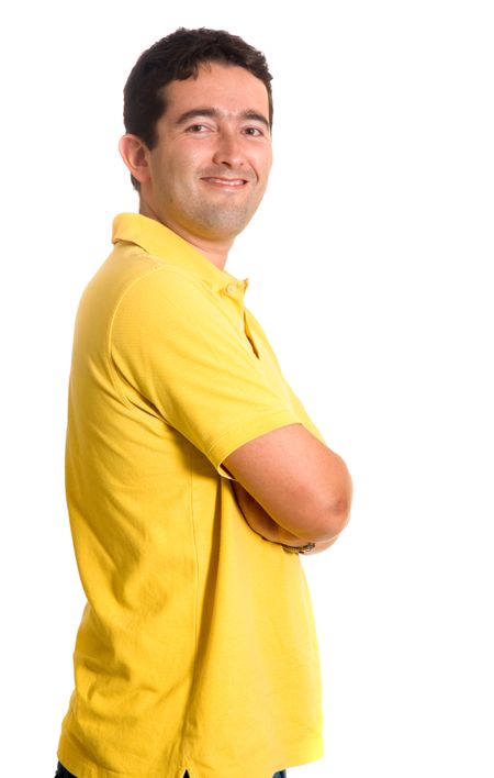 Casual guy in yellow clothes over a white background
