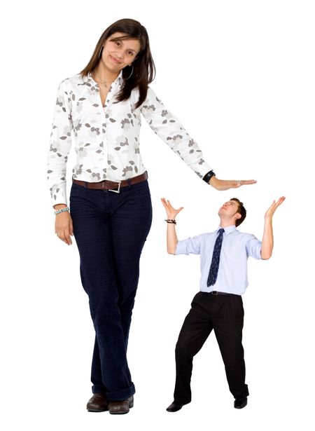Business woman displaying a man - isolated over white