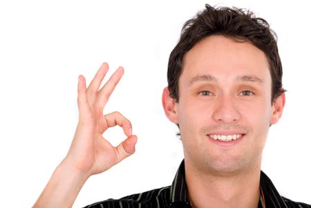 casual guy giving the ok sign - isolated over a white background
