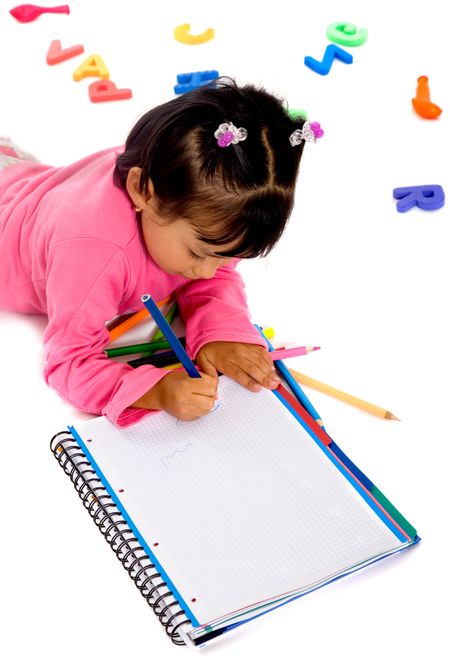 little girl doing her homework on the floor over a white background