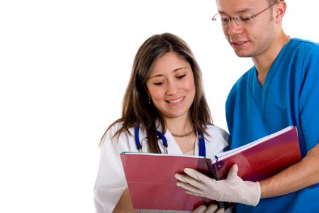 doctor and nurse looking at a notepad - isolated over a white background