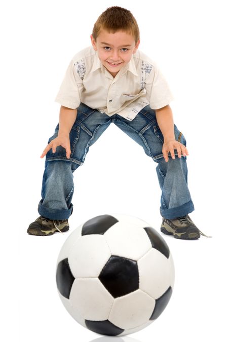child playing football - isolated over a white background