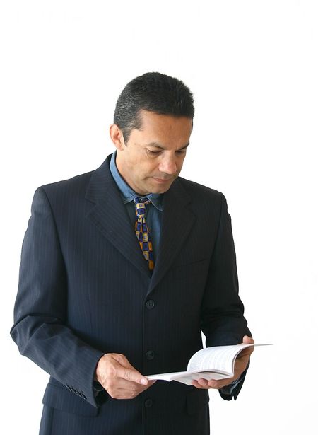 business man reading a booklet