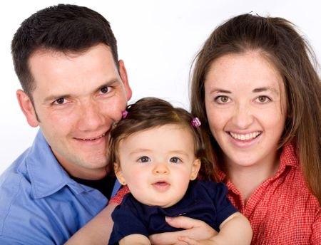 happy family portrait of a baby with her parents over a white background