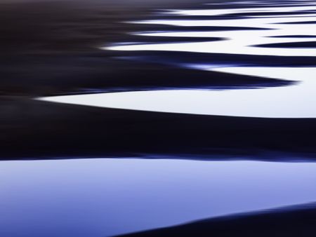 Abstract of tidal pools in succession along a sandy beach on the Pacific coast of Olympic Peninsula in Washington, USA, for themes of nature, repetition, serenity, the environment (one of a series)