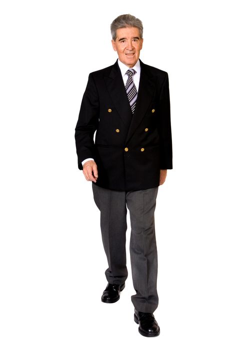 Business male senior walking towards the camera - isolated over a white background