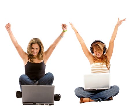 Casual girls on a laptop enjoying their success, isolated