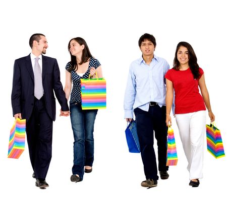 Two couples walking with shopping bags isolated