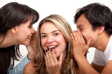 three friends whispering on  isolated white background
